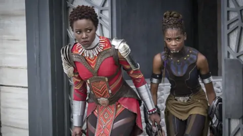 Marvel Studios L to R: Nakia (Lupita Nyong'o) and Shuri (Letitia Wright)