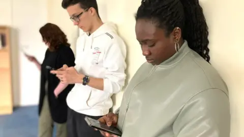 BBC/Christina McSorley Teenagers on their phones