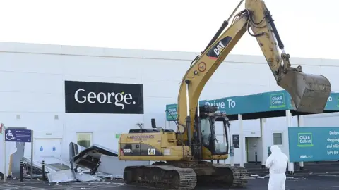 PAcemaker A large digger in the carpark of Asda in Antrim