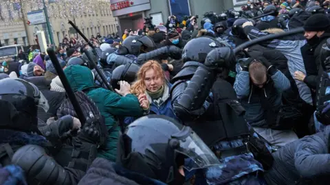 Getty Images Riot police clash with supporters of Alexey Navalny, Russian opposition leader in Moscow