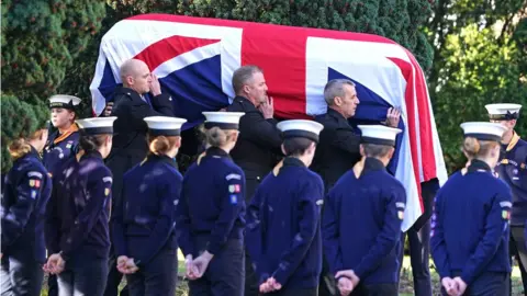 PA Media The coffin of Sir David Amess is carried into St Mary"s Church in Prittlewell, Southend for his funeral service.