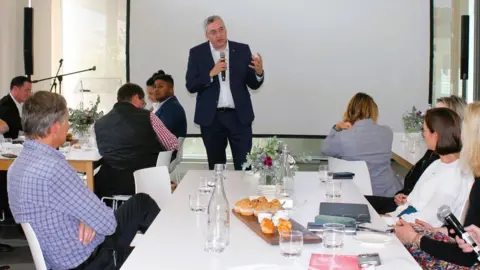 Wayne Kruger Roelf Odendaal speaking at an Indaba