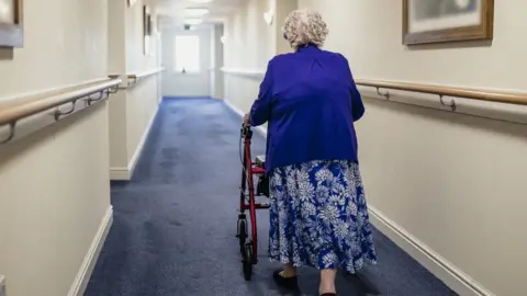 Getty Images Woman pushing frame