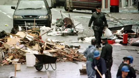 PAcemaker RUC and forensic officers sift through the debris of the Omagh explosion