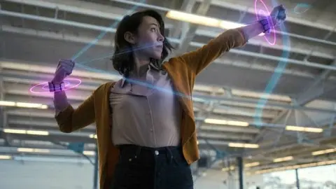 Facebook A woman using Facebook wristband prototype