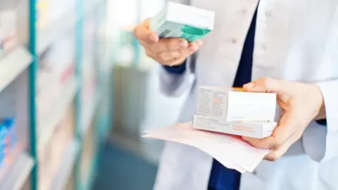 Getty Images pharmacist with drugs