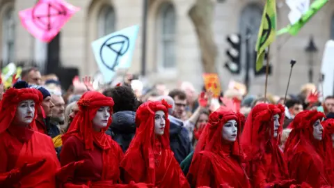 Reuters Activists protest during an Extinction Rebellion demonstration in Whitehall, London, on 18 October, 2019.