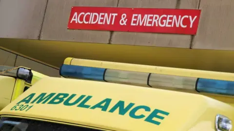 Getty Images Emergency department sign and ambulance