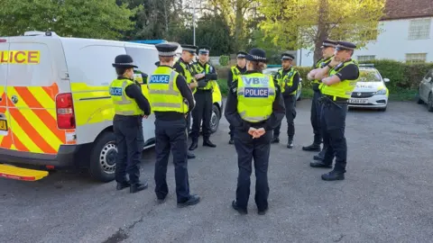 Cambridgeshire Constabulary Officers' briefing before entering the factory