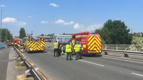 Elizabeth Baines/BBC Emergency services at the scene