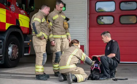 Northants Fire and Rescue Fire service staff with Olive