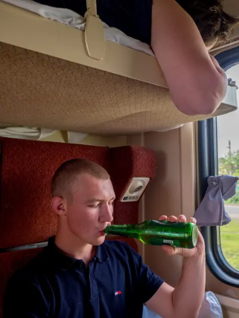Peter Dench A football fan drinking beer