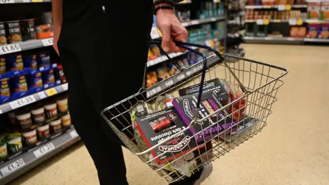 EPA A shopper at a supermarket in London in May 2023