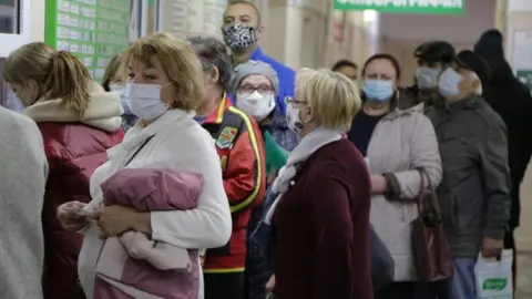 Getty Images People wait in line at Omsk's City Hospital No 17 in November