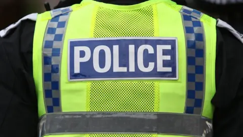 PA Media Police officer in a reflective jacket