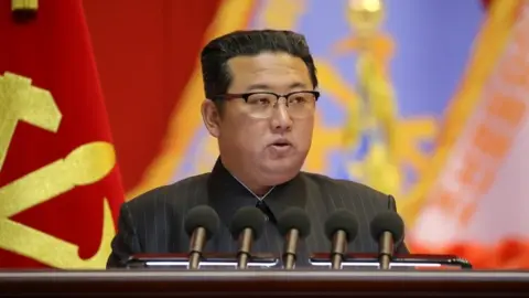 EPA North Korean leader Kim Jong Un speaks during the Eighth Conference of Military Educationists of the Korean People"s Army at the April 25 House of Culture in Pyongyang, North Korea in this undated photo released on December 7, 2021.