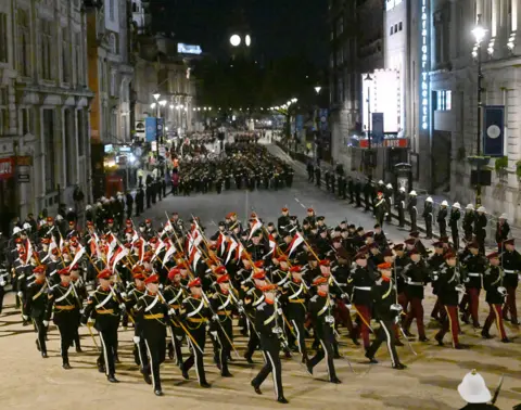 Jeff Overs / BBC Members of the military march in Whitehall during the rehearsal of the Coronation Ceremony.