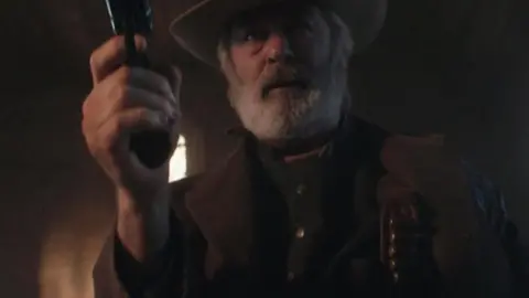 Santa Fe Sheriff's Office Alec Baldwin holding a gun