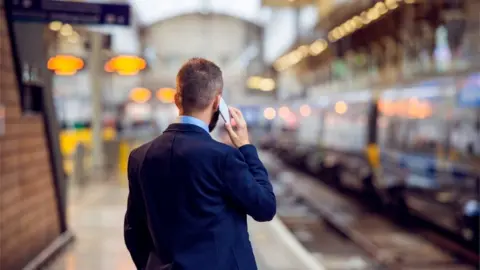 Getty Images Commuter with phone