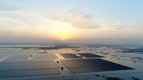 Sunrise over a huge floating solar farm in Anhui, China