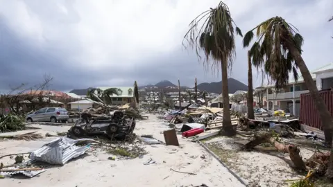 Getty Images Damage in Orient Bay on the French Caribbean island of Saint-Martin in the aftermath of Hurricane Irma, 7 September 2017