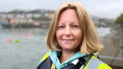 Maggie Blagrove, Open Minds Active, standing by the harbour