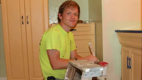 BBC Sam Duval painting a bathroom wall