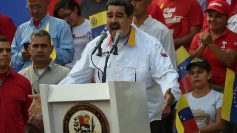 Getty Images President Nicolas Maduro delivers a speech during a pro-government demonstration in Caracas on March 23, 2019