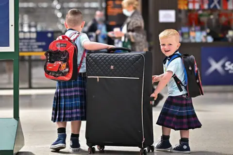 Getty Images young fans at Glasgow Central on Thursday
