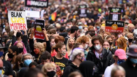 EPA Protesters are seen during an Invasion Day rally in Melbourne, Australia, 26 January 2021