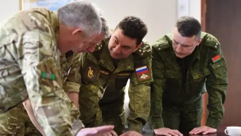MOD British Army officers briefing their Russian and Belarus counterparts