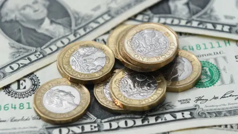 PA Media Pound coins and dollar bills