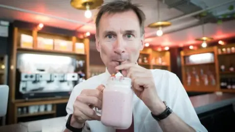 PA Jeremy Hunt drinking a milkshake