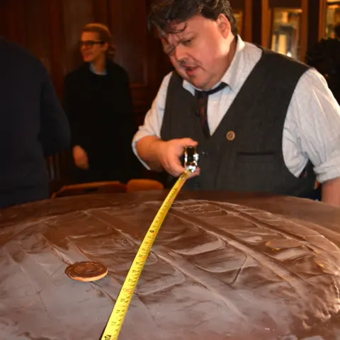 AFP Craig from Guinness World Records measures the Jaffa Cake
