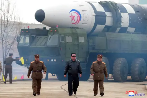 KCNA Kim Jong-un pictured in front of North Korea's largest known intercontinental ballistic missile