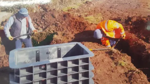 Volunteers digging the trenches