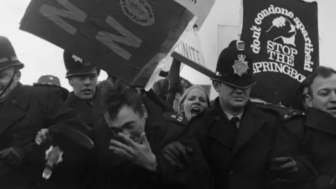 Getty Images line of police holding back protestors