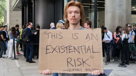 Future Publishing/Getty Images A demonstrator outside UCL where Sam Altman spoke