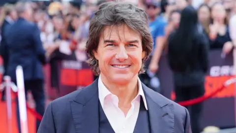 PA Media Tom Cruise arrives at the UK premiere of Mission: Impossible - Dead Reckoning Part One at Odeon Leicester Square in London. Picture date: Thursday June 22, 2023.