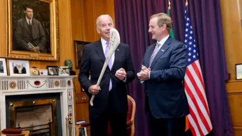 MerrionStreet.ie Joe Biden was presented with a hurl by the taoiseach (Irish PM) in 2016