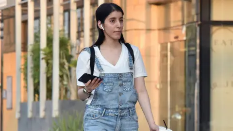 AFP File photo showing imprisoned Saudi women's rights activist Manahel al-Otaibi walking in Riyadh, Saudi Arabia (2 September 2019)