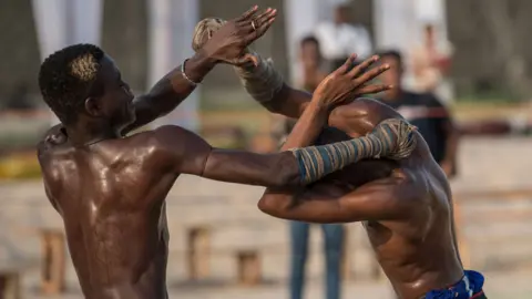 AFP Two young Dambe boxers fight in Lagos on 2 March 2018.