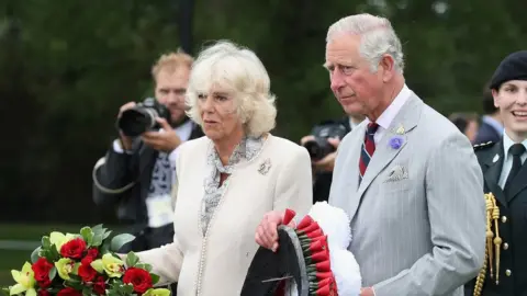 Getty Images The couple lay a wreath at the Afghanistan memorial