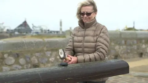 Ann Barnes destroyed the stun gun with a metal mallet