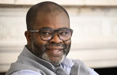Getty Images Misan Harriman head and shoulders portrait with glasses on