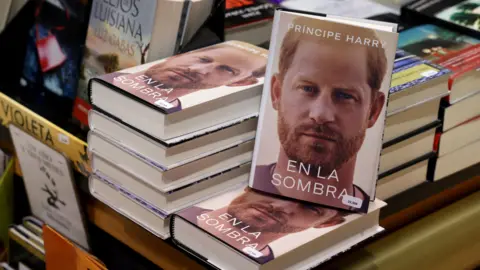 Getty Images Copies of "En la sombra" (In the shadow), Spanish version of the book "Spare", an autbiography by Britain's Prince Harry, are displayed in a bookstore in Madrid on January 10, 2023. - After months of anticipation and a blanket publicity blitz, Prince Harry's autobiography "Spare" went on sale as royal insiders hit back at his scorching revelations