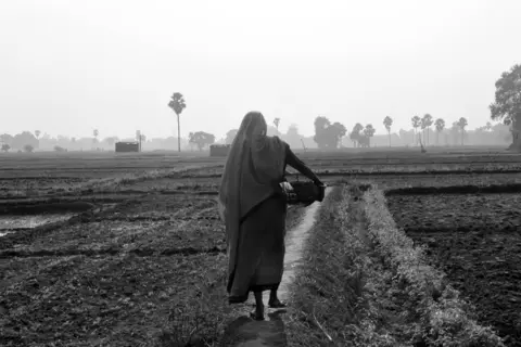 Meenadevi, from the Dom community, cleans dry latrines in a Muslim neighbourhood in Bihar's Rohtas district.