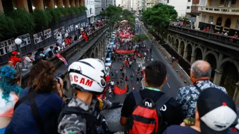 Reuters A pro-democracy march in Porto Alegre in southern Brazil, around 1,200 miles (1931km) from the capital Brasilia