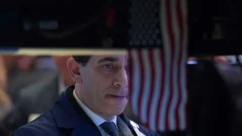 AFP/Getty Traders work on the floor at the closing bell of the Dow Industrial Average at the New York Stock Exchange on January 30, 2018 in New York.