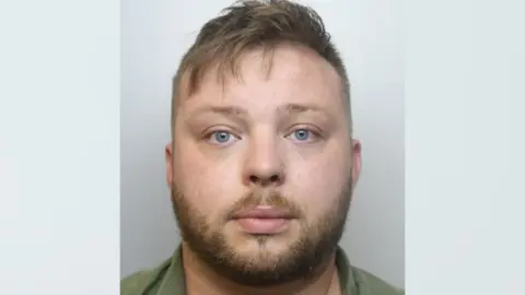 Avon and Somerset Police A mug shot of Sean Coates